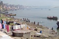 Varanasi ghats people washing clothes on the street on the banks of the river Ganges Royalty Free Stock Photo