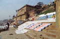 Varanasi ghats people washing clothes on the street on the banks of the river Ganges