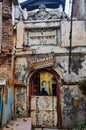 Varanasi, India - Dec 24, 2019: View of an old hostel in a traditional narrow street in the old city of Varanasi, India