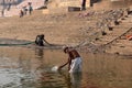 VARANASI, INDIA - December 26, 2014: Laundry in holy Ganges river, Varanasi, India