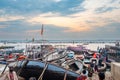 old wooden boats at the pier on the border of river Ganges in morning light with people on pier in Varanasi Royalty Free Stock Photo