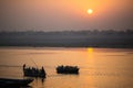 Pilgrims on boat floating on the waters of sacred river Ganges early morning. Royalty Free Stock Photo