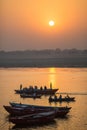 Pilgrims on boat floating on the waters of sacred river Ganges early morning. Royalty Free Stock Photo