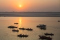 Pilgrims on boat floating on the waters of sacred river Ganges early morning. Royalty Free Stock Photo