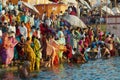 Pilgrims bathe in Holy Ganges river at sunrise in Varanasi, India.