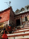 Hindu pilgrims climb the steps of a Shiva temple