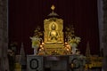 Varanasi, India: Golden statue of sitting Buddha in meditation at the Buddhist temple Mulagandhakuti vihara, Royalty Free Stock Photo