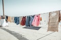 Varanasi, India, 15 november, 2019/ Life on the Ganges: colorful clothes drying at the sun on the steps leading to the river.