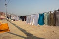 Varanasi, India, 15 november, 2019/ Life on the Ganges: colorful clothes drying at the sun on the steps leading to the river.