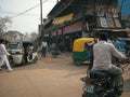 Details of chaotic street of Varanasi with people and vehicles