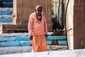 Varanasi, India, 15 november, 2019 / two Indian yogi or sannyasi men, of hinduist religion, dressed in orange with rasta hair,