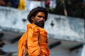 Varanasi, India, 15 november, 2019 / two Indian yogi or sannyasi men, of hinduist religion, dressed in orange with rasta hair,