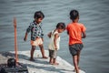 Varanasi, India, 15 novembre, 2019/ Life on the Ganges: poor indian children of lower chaste playing on the steps leading to the