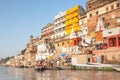 Varanasi, India Ã¢â¬â October 11, 2010: People start to descend to the Ganges to bathe on the ghats in the morning sun Royalty Free Stock Photo