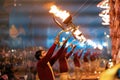 17.12.2019, Varanasi, India. Sacred religious ceremony Arati in the temple. Men standing in a row hold lighted torches Royalty Free Stock Photo