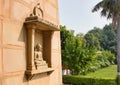 Varanasi, India: Sculpture of buddha carved in a wall of famous Buddhist temple mulagandhkuti vihara in Royalty Free Stock Photo