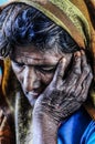 Varanasi, India, septemper 16, 2010: Old indian woman resting he Royalty Free Stock Photo