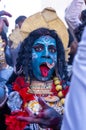 Artist act as gddess kali with painted face during masaan holi in varanasi