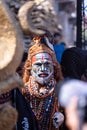 Male artist act as lord shiva with painted face during masaan holi in varanasi