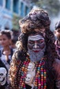 Male artist act as lord shiva with painted face during masaan holi in varanasi