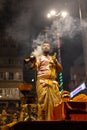 Portrait of hindu male priest performing ganga aarti in varanasi