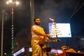 Portrait of hindu male priest performing ganga aarti in varanasi