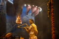 Portrait of hindu male priest performing ganga aarti in varanasi