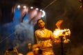 Portrait of hindu male priest performing ganga aarti in varanasi