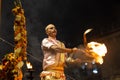 Portrait of hindu male priest performing ganga aarti in varanasi