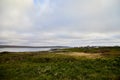 Varde, Norway - June 23, 2019: Calm landscape with water and fishing village on the bank of a beautiful fjord in a morning, Norway