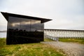 Vardo, Norway - 23 June 2019: Black kube building which is memorial devoted to memory innocently killed during witch hunting. Royalty Free Stock Photo