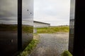 Vardo, Norway - 23 June 2019: Stylized bonfire and mirrors in a black cubic building with glass in the Museum a memorial dedicated