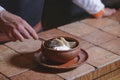 Vareniki dumplings, traditional Ukrainian food served in a ceramic bowl in a restaurant.