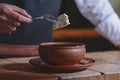 Vareniki dumplings, traditional Ukrainian food served in a ceramic bowl in a restaurant.