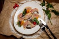 Vareniki with strawberries, mint on a large white plate, on the background of kraft paper