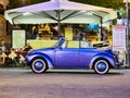 VARENNA, ITALY - AUGUST 6, 2017: Vintage purple Volkswagen Beetle convertible in Varenna, Italy Royalty Free Stock Photo