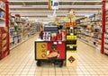 Lanes of shelves with goods products inside of the IPER of Varese hypermarket. Breakfast department with coffee counter in promoti