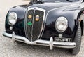 The front of the Black Vintage Italian car Lancia Aurelia, model B10, made in Italy in 1951.