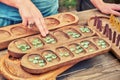 Vari Ovare is a board logic game for two from the family of mancala games. People play an ancient board game of the Mancala, Royalty Free Stock Photo