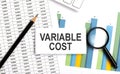 VARIABLE COST text on white card on the chart background