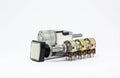 Variable resistor and switch on white background.