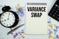 Variance Swap text written on notepad with calculator and alarm clock Royalty Free Stock Photo