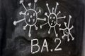 Variant of the coronavirus, omicron BA. 2, drawn on a blackboard with chalk