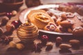 Variation of Christmas cookies, gingerbread man and nuts with candle and ornaments Royalty Free Stock Photo