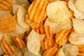Variation of crispy and corrugated potato chips background