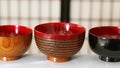 Variation of Japanese lacquered bowls in a row