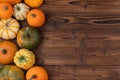 Variation of pumpkins on wooden table