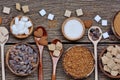 Variation sugar in a bowls and spoons on table