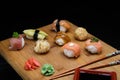 Sushi Set sashimi and rolls served on wooden desk Royalty Free Stock Photo