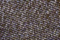 Varicolored tweed like texture, varicolored wool pattern, textured melange upholstery fabric background copy space.